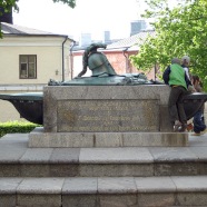 Children play on stature in Helsinki